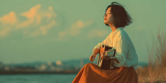 ChatGPT提示词_年轻日本女子在宁静的草地河岸上独自弹吉他，穿着白色衬衫和橙色裙子_gpt会员多少钱缩略图