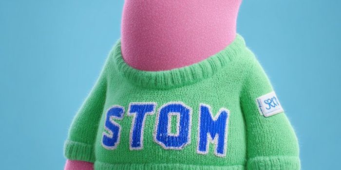 ChatGPT提示词_一个以皮克斯3D动画和美式漫画风格结合的粉色拟人化角色，名为“胃”，穿着印有蓝色“STOMACH”的绿色毛衣，展示了自信和快乐的表情_chatgpt中文版免费入口缩略图