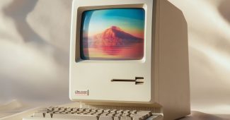 Ai提示词_1980年代的Mac One风格电脑产品摄影，正面展示，背景为自然白渐变，散发复古未来主义气息_chat gpt会员怎么购买缩略图