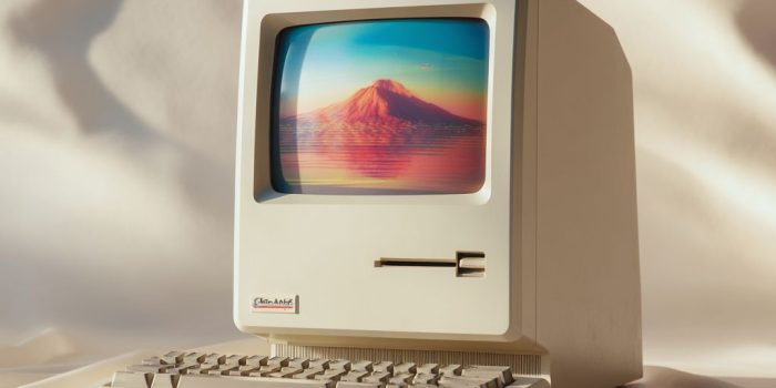 Ai提示词_1980年代的Mac One风格电脑产品摄影，正面展示，背景为自然白渐变，散发复古未来主义气息_chat gpt会员怎么购买缩略图